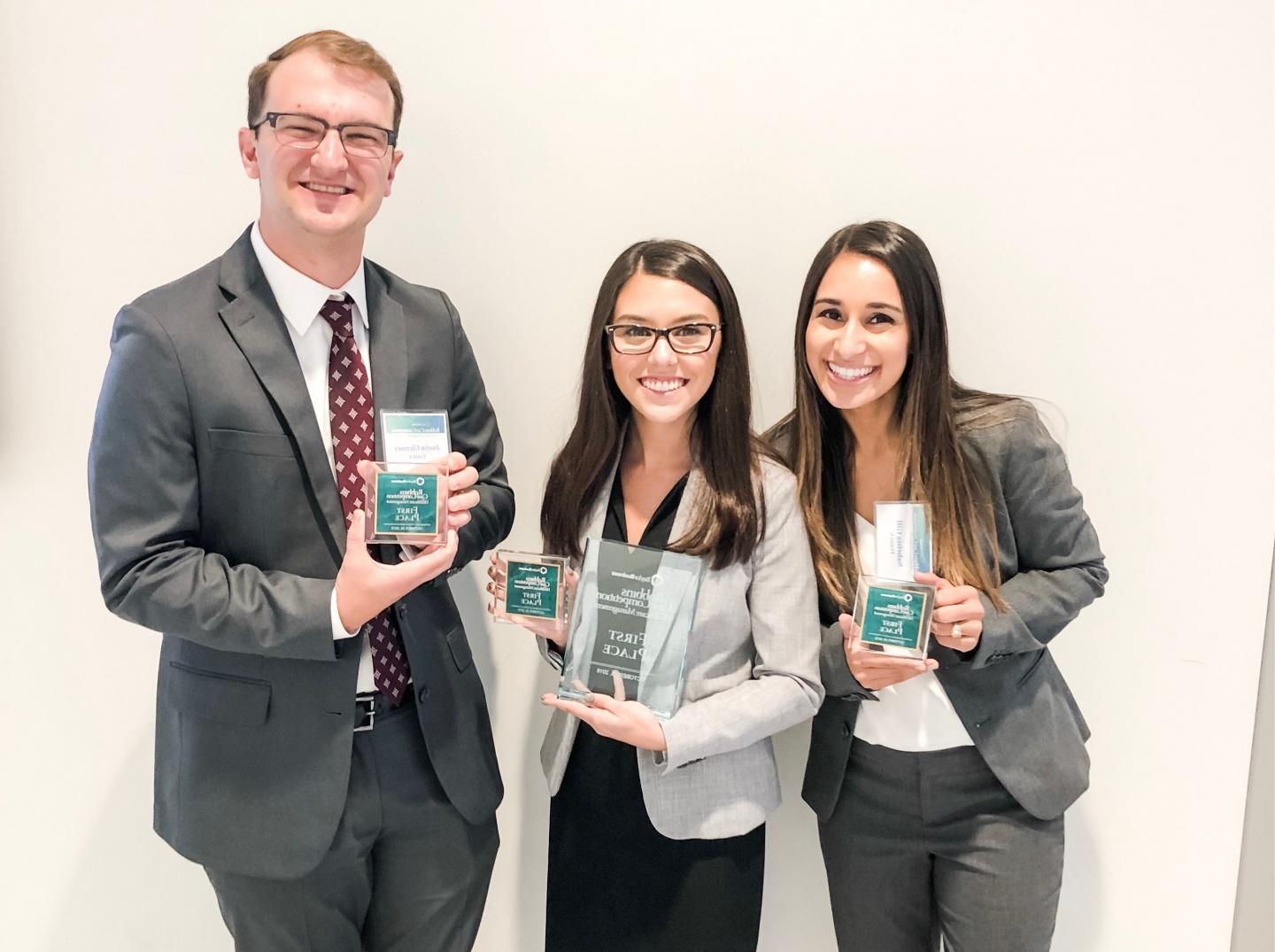 Sabrina, Andy, and Justin take first place at a case competition.