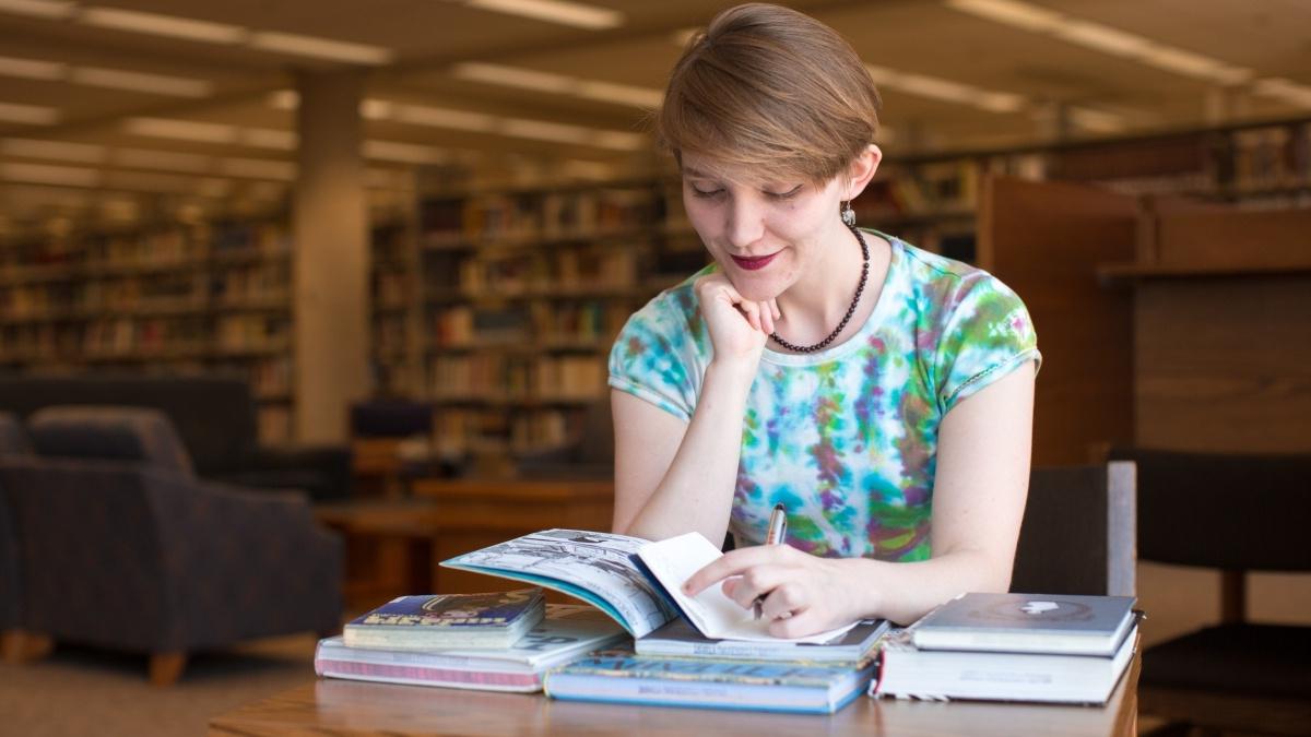 A student reads in the library