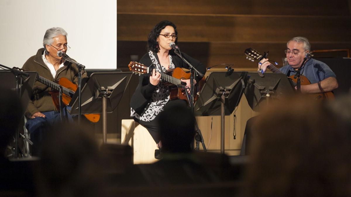 three musicians play string instruments in Parker chapel