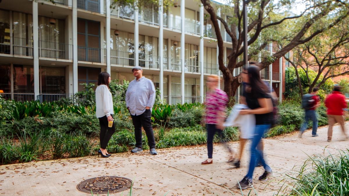 Faculty and Staff mingling outside of the Chapman Center on campus